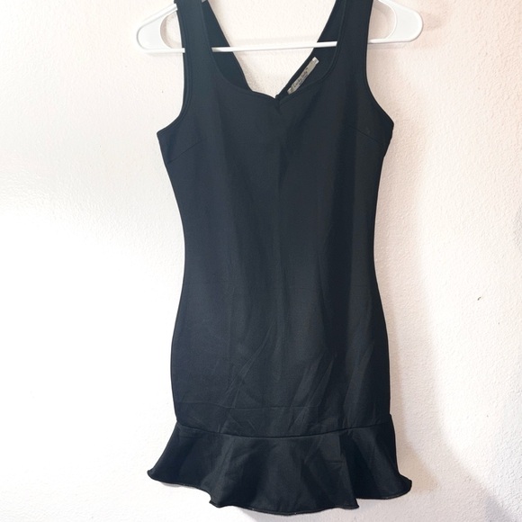 Lucky Lady Dresses & Skirts - Lucky Lady Black Tight Mini Dress with Ruffled Hem, V Neckline